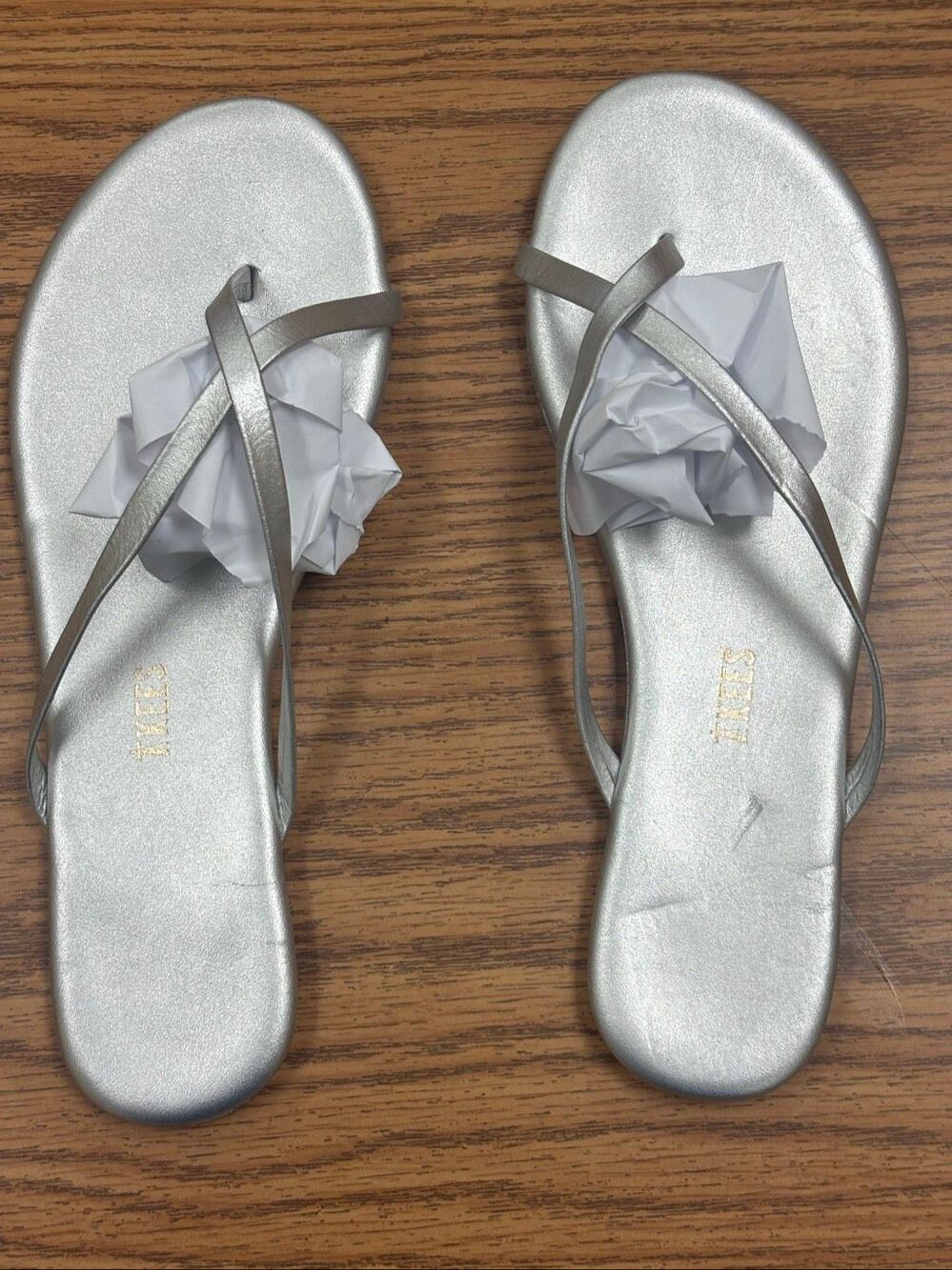 Two pairs of Tkees, flip-flop sandals